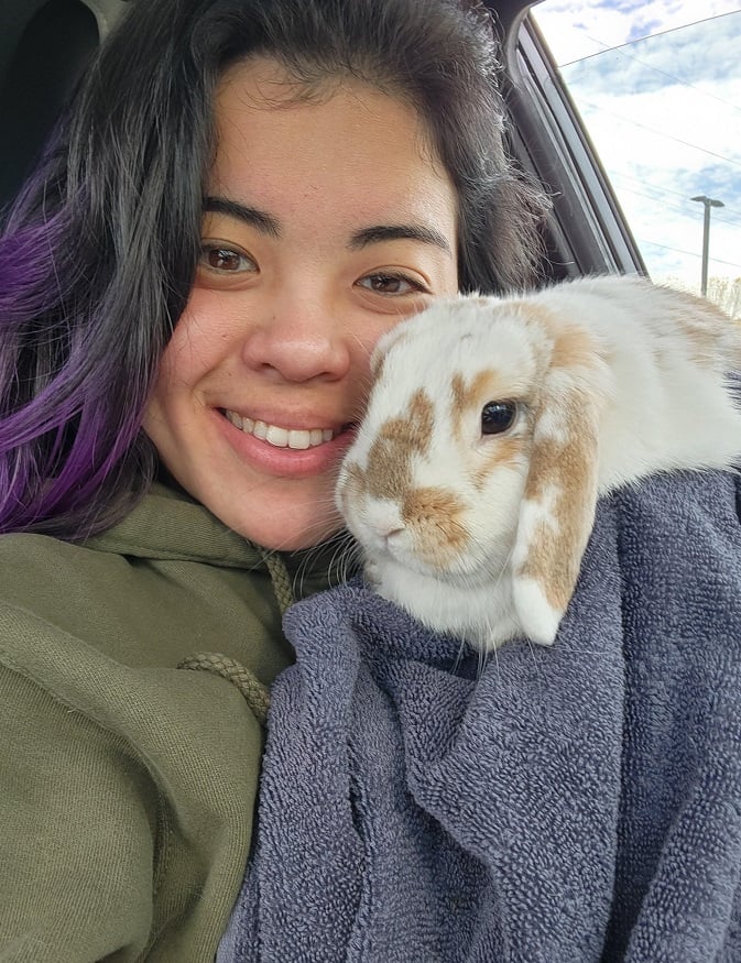 Ariane Nissenbaum snuggles with a pet rabbit